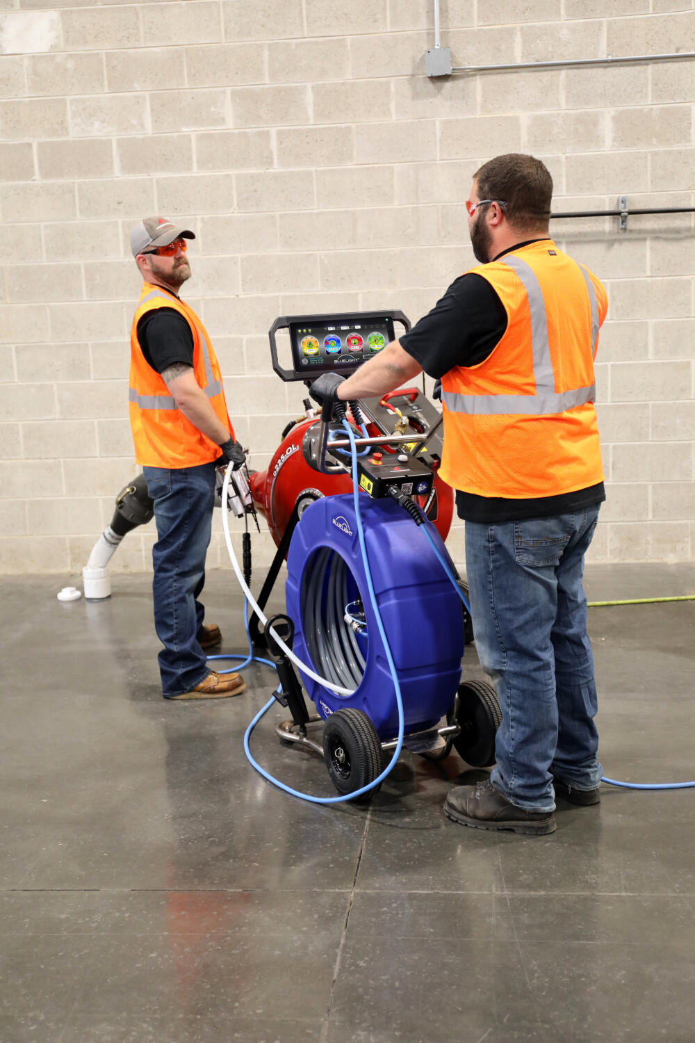 Two men installing blue light