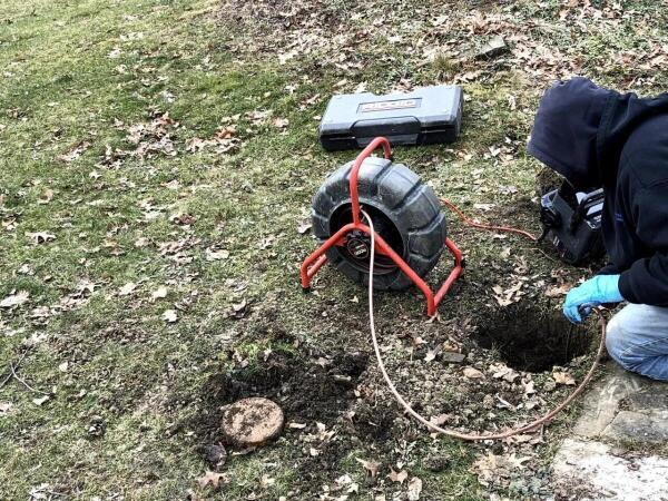 Sewer Cleaning company technician conducting sewer drain video inspection